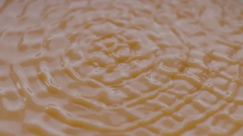 Orange Liquid Vibrate on Sounds Waves in Slow Motion Stock Footage 86422256