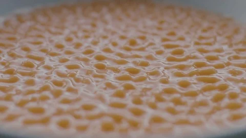 Orange Liquid Vibrate on Sounds Waves in Slow Motion Stock Footage 86422447