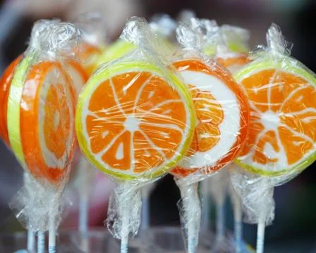 Orange lollipops Stock Photos