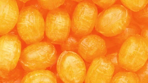 Orange lollipops, rotation in circle.  스톡 동영상 246147095