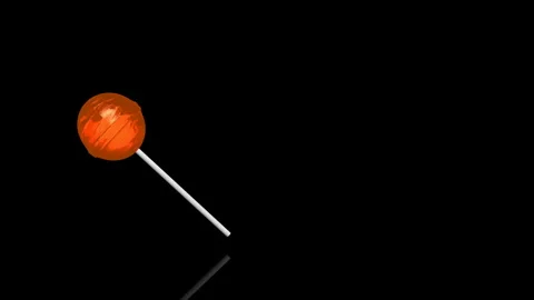  Orange Lollypop turns on itself - loop animation - black background Stock Footage 255459379