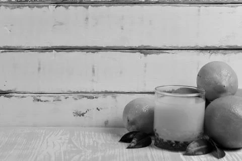 Orange lying on a wooden table Stock Photos