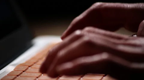 Orange Mac laptop typing jib down Stock Footage 47481212