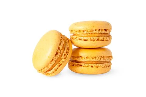 Orange macaron cookies in stack isolated on white background Stock Photos