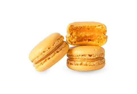 Orange macaron cookies in stack isolated on white background Stock Photos