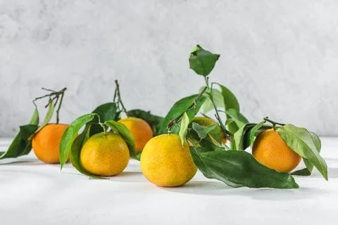 Orange mandarin on white table Stock Photos