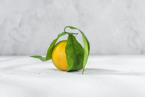 Orange mandarin on white table Stock Photos