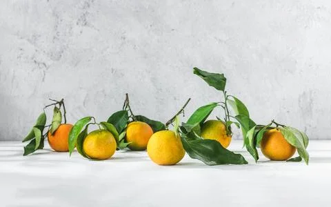 Orange mandarin on white table Stock Photos