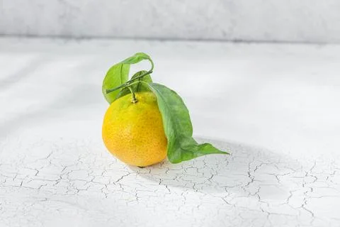Orange mandarin on white table Stock Photos