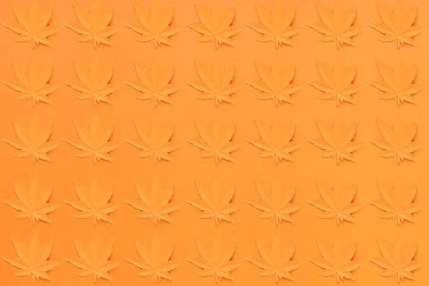 Orange maple leaf cut from paper on orange background Stock Photos