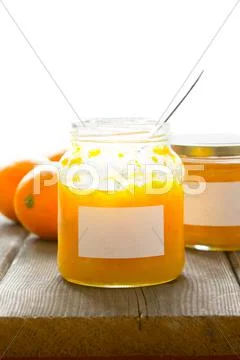Orange marmalade jars labels spoon
