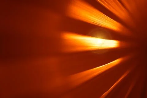 Orange metal surface with dramatic light flare background Stockfoto's