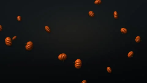 Orange mini pumpkins falling on dark slate, autumn harvest 4K seamless loop Видео 347991720