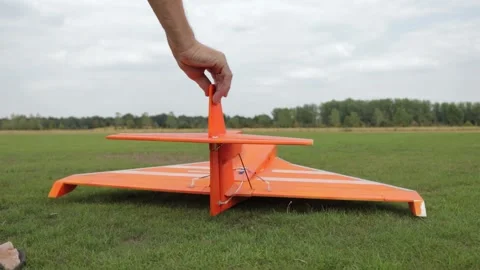 Orange Model Plane Taking Off With An Extra Push Stock Footage 130676646