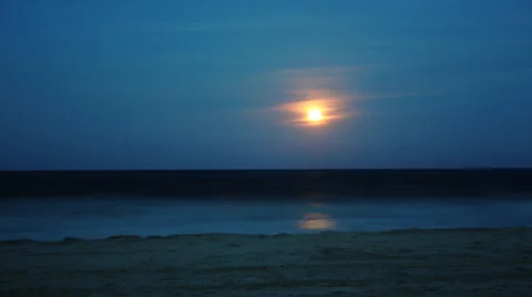 Orange moon rise over ocean time lapse Stock Footage 28174553