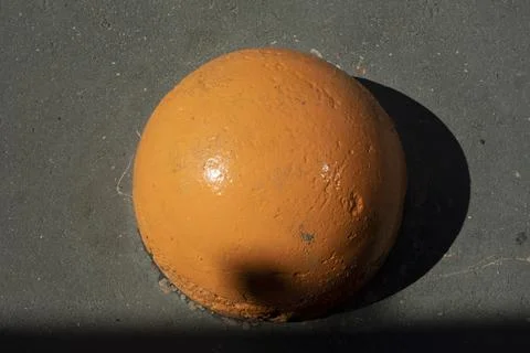 Orange motion blocker. Parking post. Sphere for transport. Stock Photos