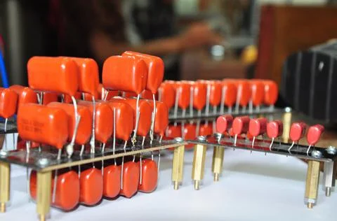 Orange mylar capacitors connected in parallel Stock Photos