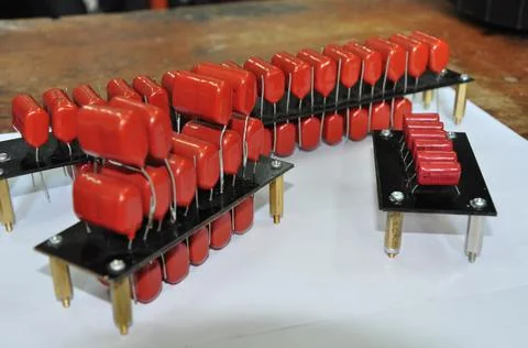 Orange mylar capacitors connected in parallel Stock Photos