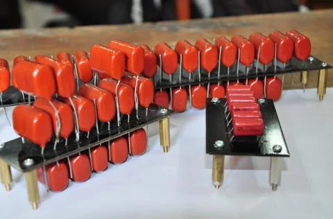 Orange mylar capacitors connected in parallel Stock Photos