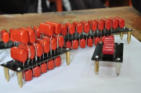 Orange mylar capacitors connected in parallel Stock Photos