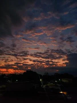 Orange night sky with dense clouds Фото