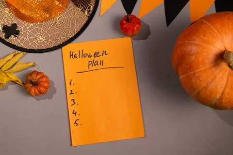 Orange Note Says Halloween Plan is Lying Near Halloween Decorations Stock Photos