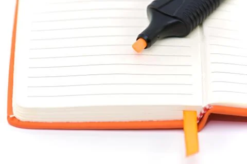 Orange notepad and marker Stock Photos