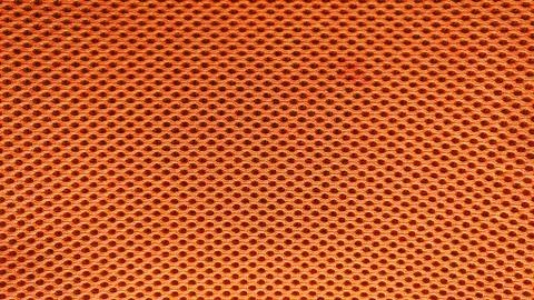 Orange nylon fabric pattern texture background. Stock Photos