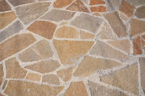 Orange old stone road surface. Seamless Texture. The texture of a stone road Stock Photos