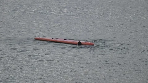 Orange Paddleboard Floating on Lake Water Stock-Footage 345038228