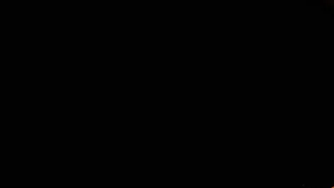 Orange paint splash thrown in slow motion, liquid isolated on black (4K) Stock Footage 137111414