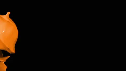 Orange paint splash thrown in slow motion, liquid isolated on black (4K) Vidéo 137111883