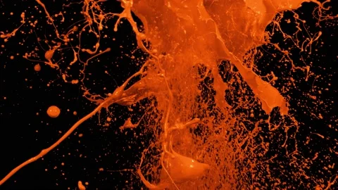 Orange paint splash thrown in slow motion, liquid isolated on black (4K) Vidéo 137112574