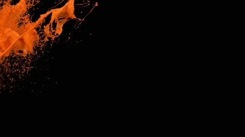 Orange paint splash thrown in slow motion, liquid isolated on black (4K) Stock Footage 137112788
