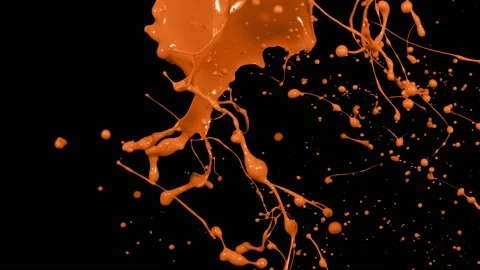 Orange paint splash thrown in slow motion, liquid isolated on black (4K) Stock Footage 137112905