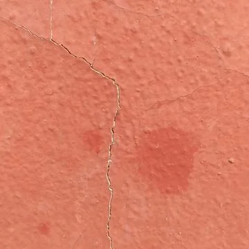 Orange Painted Wall Texture with Crack and Rough Plaster Foto stock