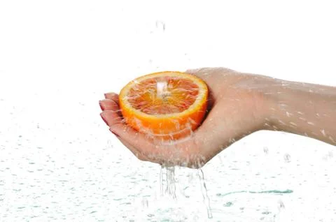 Orange in palms Stock Photos