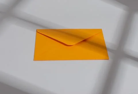 Orange paper envelope. Letter, mail, post, communication and correspondence.. Stock Photos