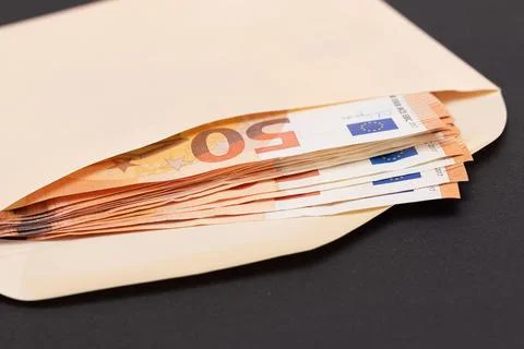 An Orange Paper Envelope with Stack of 50-Euro Banknotes Inside Stock Photos