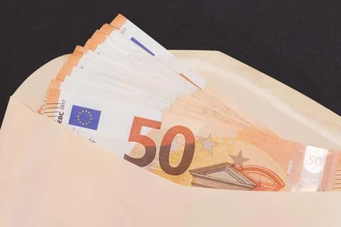 An Orange Paper Envelope with Stack of 50-Euro Banknotes Inside Stockfoto's