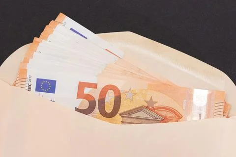 An Orange Paper Envelope with Stack of 50-Euro Banknotes Inside Stockfoto's