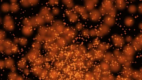 Orange particles gently float against dark background with cinematic motion.. Stock Footage 343419953