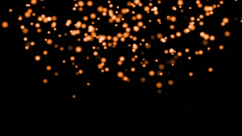 ORANGE particles glowing on the black background. Black background with light Stock Footage 218579108