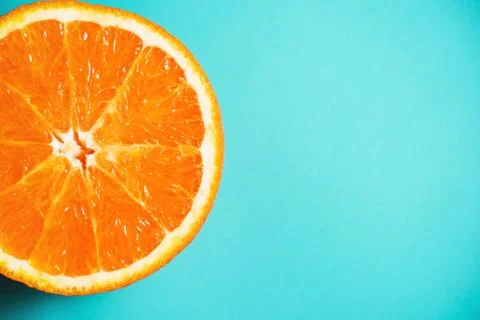 Orange pattern on the light turquoise background. Stock Photos