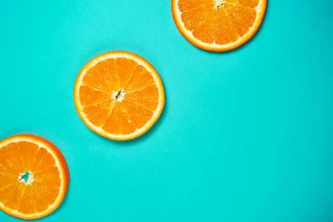 Orange pattern on the light turquoise background. Stock Photos