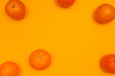 Orange pattern on orange background citrus arrangement Stock Photos