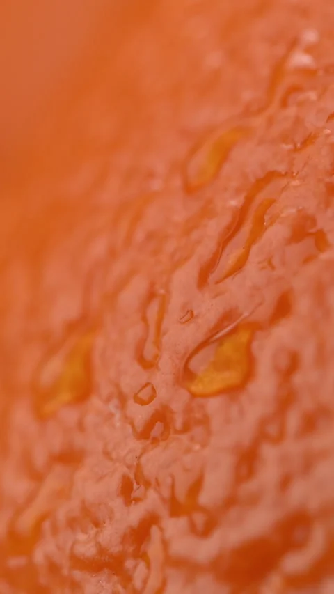 Orange peel juice drop macro, sensual warm texture skincare beauty overlay. Vidéo 332216615