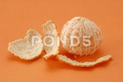 Orange Peel Lying Beside Peeled Mandarin Orange