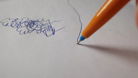 Orange Pen Drawing a Vertical Blue Line on Plain White Paper Surface Stock Footage 339365815