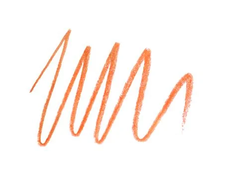 Orange pencil scribble on white background, top view 写真素材